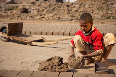 Child laborer making bricks - Lahore