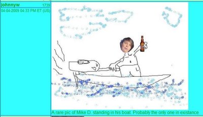 Picture of Mike standing up in the boat.
