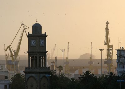 The city's historic clock tower in front of the port