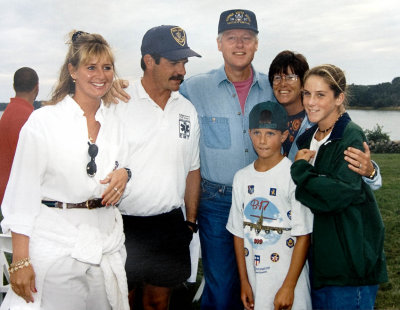 David, Stephanie, Sam and Sara Bell with President Clinton at a party, summer of 1997