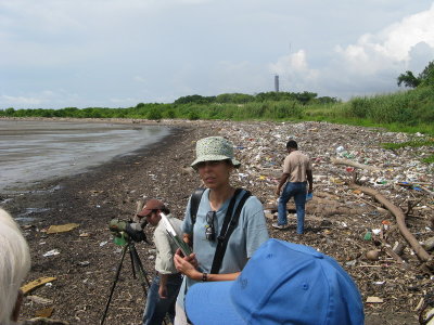 At the beach- lots of trash washes up from the nearby city