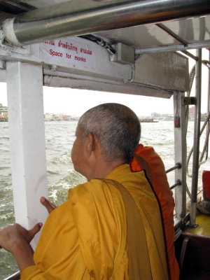 Standing room only on the ferry- but special accomodations for monks!