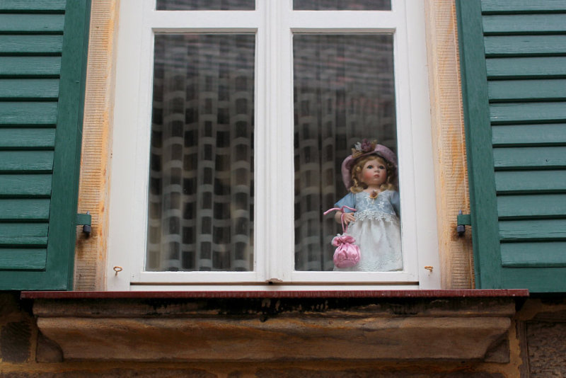 Window with a doll