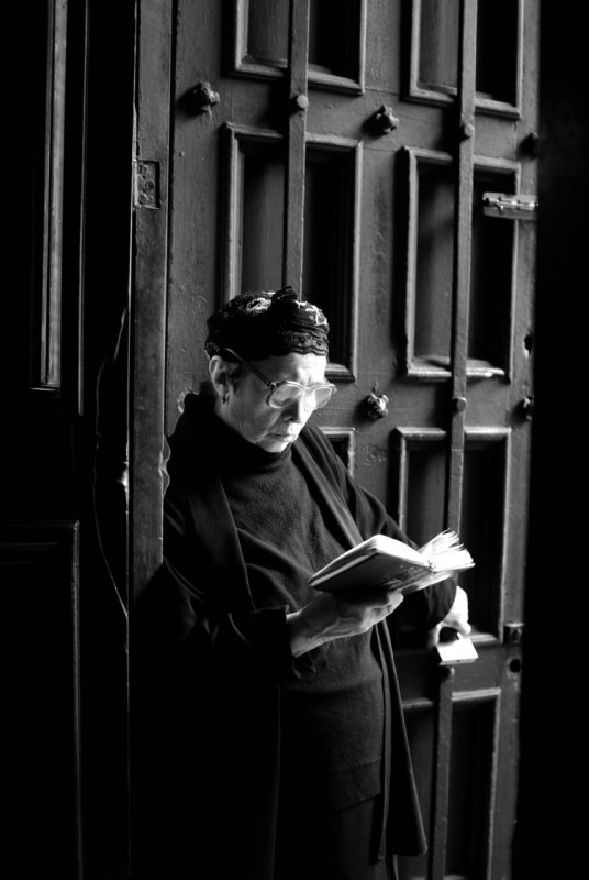 Woman reading in church - Tbilisi.