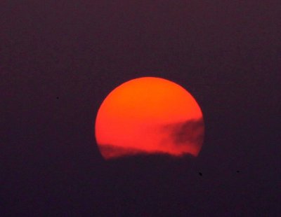 Red Sun Setting After Storm