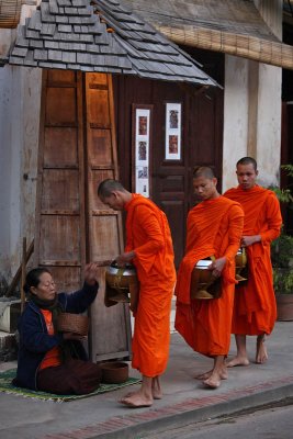 Monks collecting alms