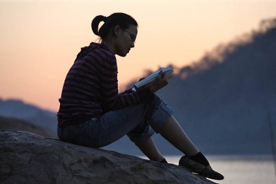 Sunset reading at Mekong River