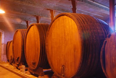 AND SOME BARRELS COULD HOLD HUNDREDS OF GALLONS OF WINE