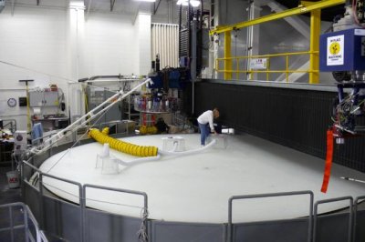 THIS PICTURE SHOWS THE MASSIVE OVEN THAT SPINS WHILE PRODUCING  MIRRORS AT HIGH TEMPERATURE