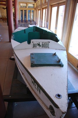 THIS IS A MODEL OF THE TYPE OF BOATS USED BY THE FIRST PERSONS TO RUN THE RAPIDS OF THE GRAND CANYON
