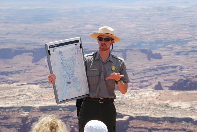 THIS RANGER EXPLAINED THE MANY ROCK LAYERS THAT APPEAR IN THE BACKGROUND