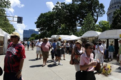 THE ARTISTS' BOOTHS LINED BOTH SIDES OF THE SQUARE AND DOWN THE STREET TO THE FRANK LLOYD WRIGHT CONVENTION CENTER