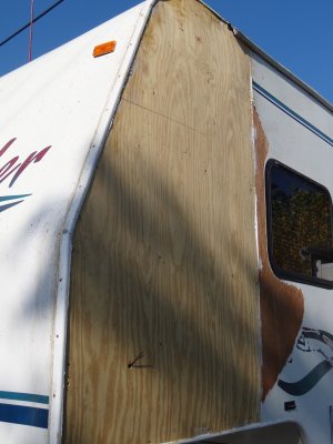 A FINISHED REPAIR JOB UNTIL WE GET BACK TO CALIFORNIA AND COVER THE NEW PANEL WITH FIBERGLASS