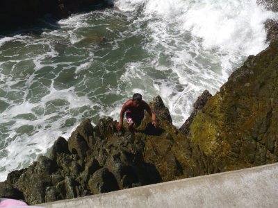 Diver Climbing Rocks