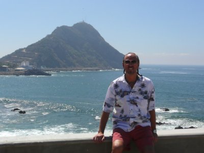 Bill with Faro Lighthouse (2nd Highest in World) in Background