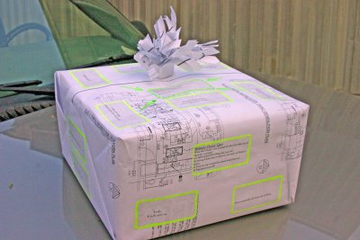 Charlie's retirement gift wrapped in blueprints