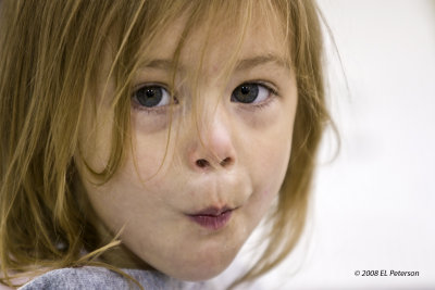 This little cutie was very busy eating candy and watching her dad play hockey.  I was there to watch my daughter play hockey.