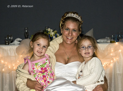 A couple of special friends getting their picture taken with the bride.