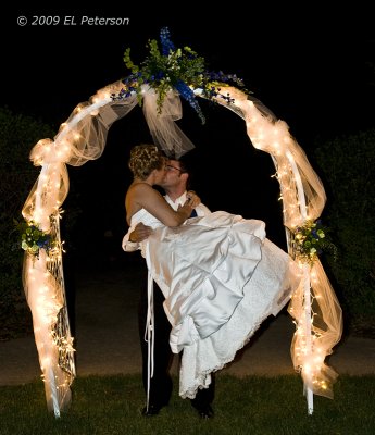 A kiss under the arch.