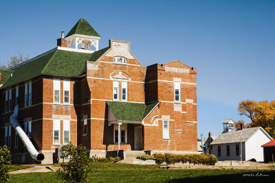 As the country grew so did the school systems. The old Cramer School is in the background with the new school system in the foreground. The old school was built in 1875 and the new school built 1886. Today, the new school serves as a museum.
An image may be purchased at http://edward-peterson.artistwebsites.com/featured/progress-edward-peterson.html