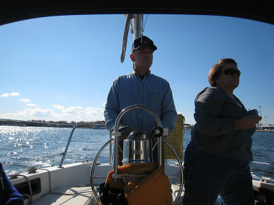 Gerry at the Helm and Karen looking out