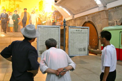 Reading the Workers News in the Metro, Pyongyang