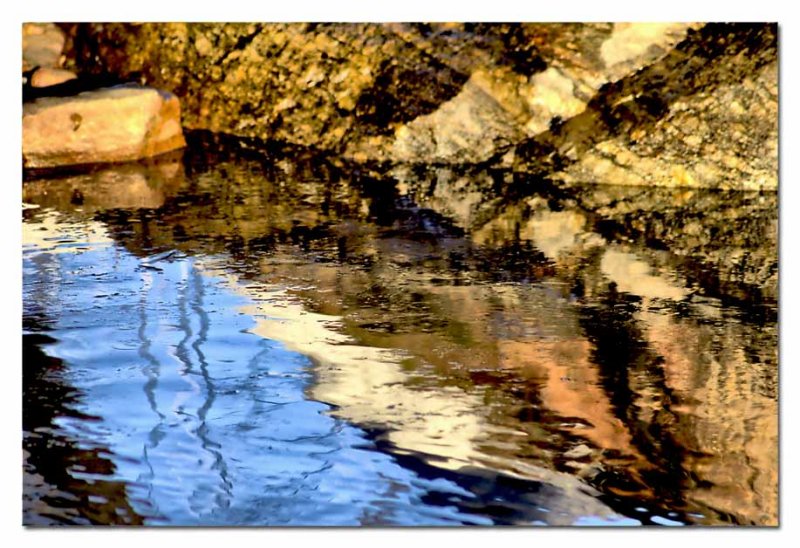 reflections by a rock....