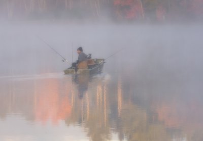 Fishing in  the early morning  mist 