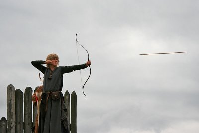 Shooting archer and flying arrow