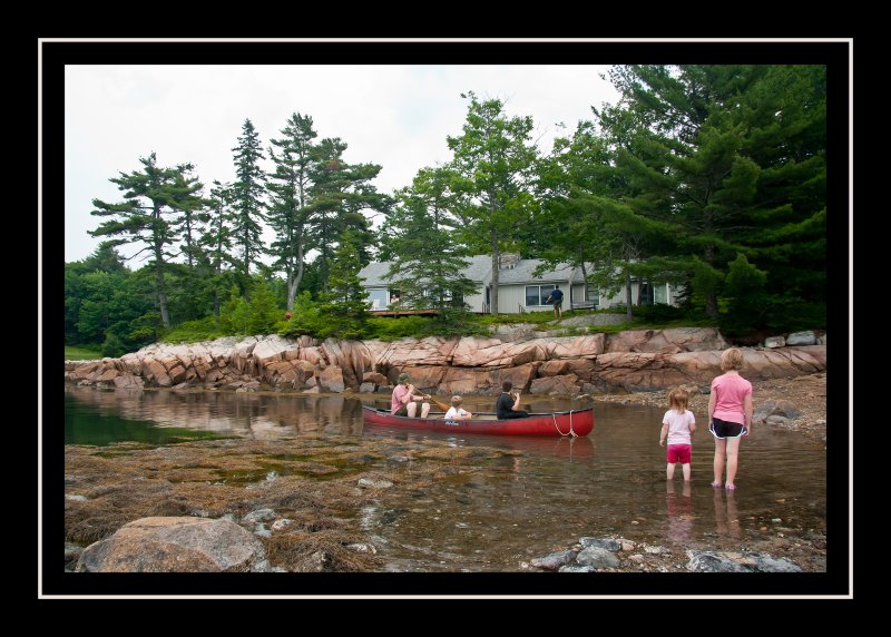 Canoe test run as Norah and Emmy look on