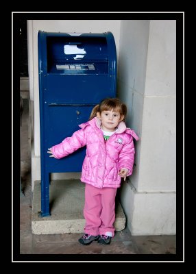 Norah insisting on a picture with the mailbox