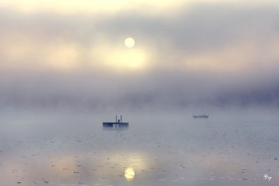 Misty sunrise over a lake