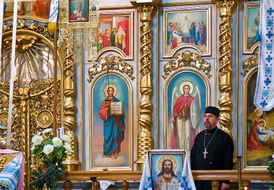 Orthodox Church Iconostasis And Priest