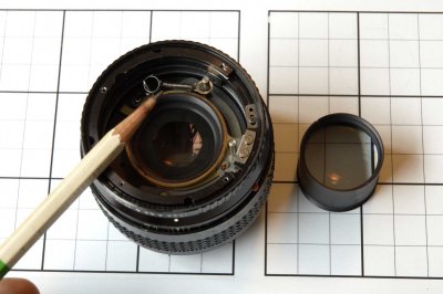 PF85m_6: Install a spring to control aperture