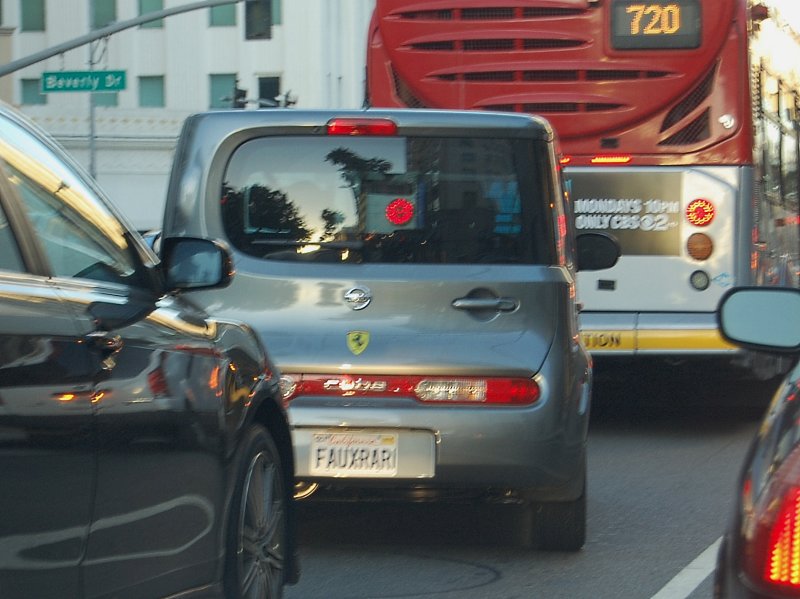 Faux Ferrari plate & Ferrari badge on Nissan Cube