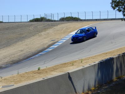 Mitsubishi Evo in Laguna Seca's famed Corkscrew