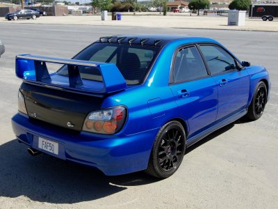 2nd generation Subaru WRX blue with carbon fiber trunk and hood