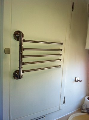 RV makeover with aluminum towel holder, washcloth hook and cabinet door knobs