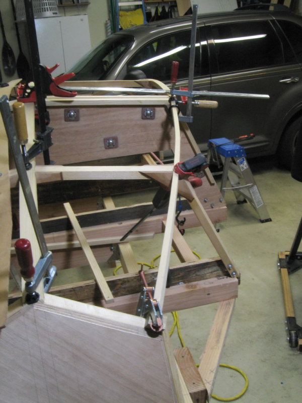 Forward starboad chine log, first lamination:  lots of twist and a captured notch in the transom.