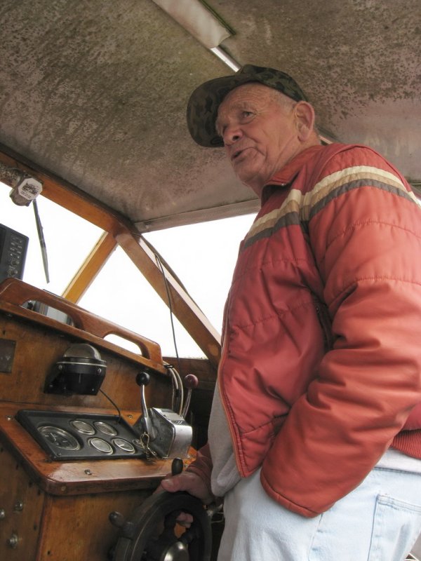 Jim presiding at the helm of his custom-built 29 foot Bartender.