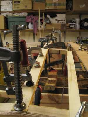 Keelson glue-up, in two layers.  Full thickness too stiff to bend on without depressing frames.