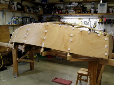 Starboard panel in place, held in position with plastic washers while the epoxy cures.