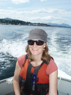 Suzanne digs the breeze, astride the engine box, headed over to Montague.