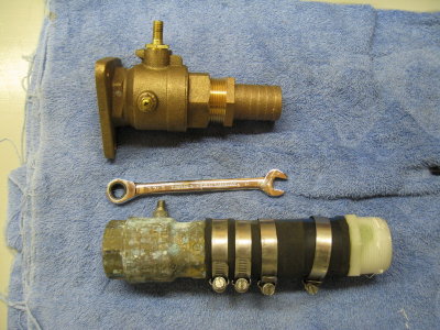 New bronze seacock/hose barb vs old brass equivalents and hose.  Handles removed.