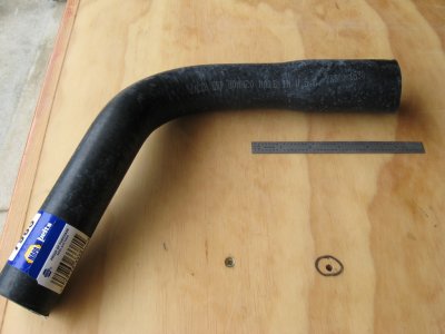 Molded radiator hose:  1-1/2 inch one end necking to 1-1/4 inch.