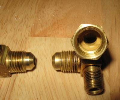 The elbow and the T had compression fittings mated to NPT fittings. My bad. They leaked and were replaced.