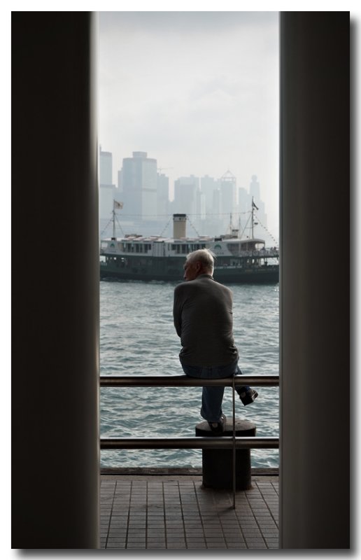 an old star ferry and an onlooker