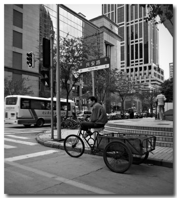 waiting at a crossroad, shanghai city centre...