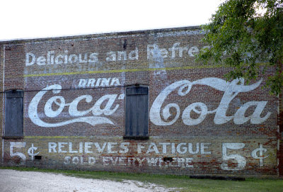 Demopolis Coca-Cola sign, relieves fatigue.