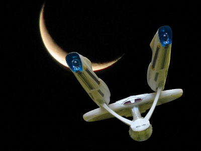 Enterprise Approaching Crescent Moon